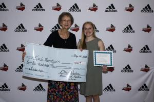 Boone High School Senior, Karli Herrstrom, receives scholarship from Boone County Central Committee Member, Barb McGregor.